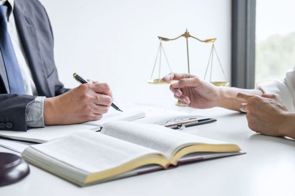 Businesswoman and Male lawyer or judge consult and conference having team meeting with client at law firm in office, Law and Legal services concept.