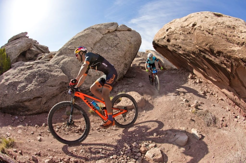 Payson McElveen leads Justin Lindine during the Moab Rocks mountain bike race near Moab, Utah, USA on April 15, 2018. Moab Rocks is a three-day cross-country mountain bike stage race. (John Gibson Photo/Gibson Pictures)