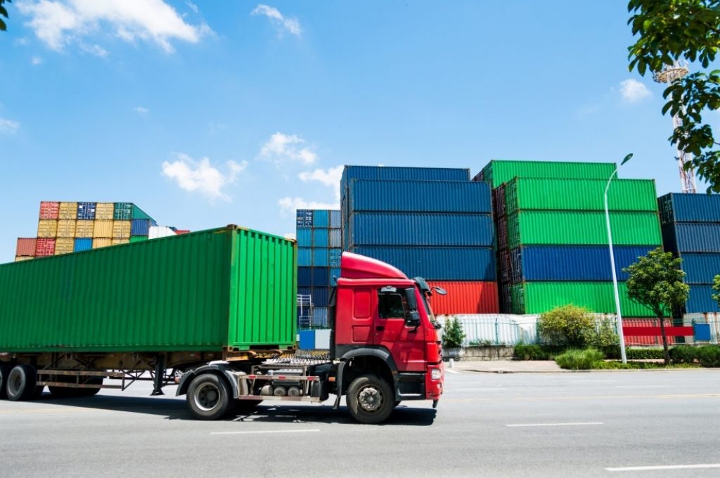 Truck transport container leaving the harbor.